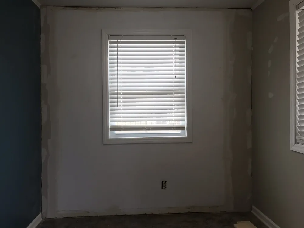 Before: dining nook remodel with a shiplap feature wall
