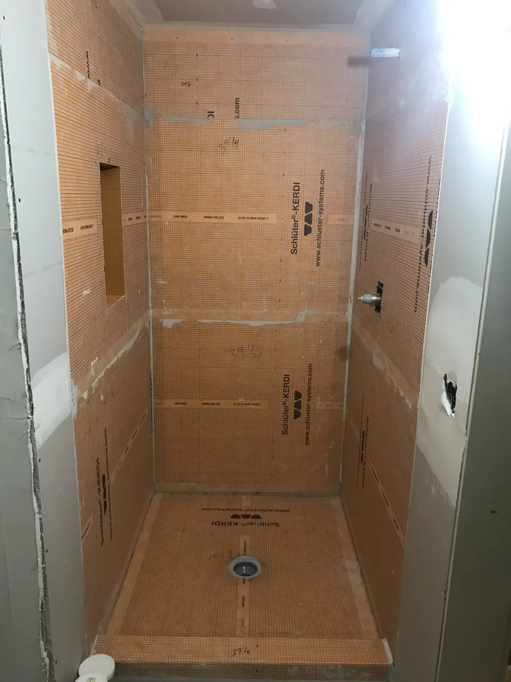 Before: primary shower rebuild with marble tile